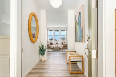 Beautiful accent furniture and light fixtures continue onwards into the home.