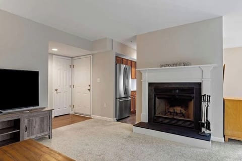 Living Room Retreat: Enjoy the warmth of the fireplace and an open layout perfect for relaxation!