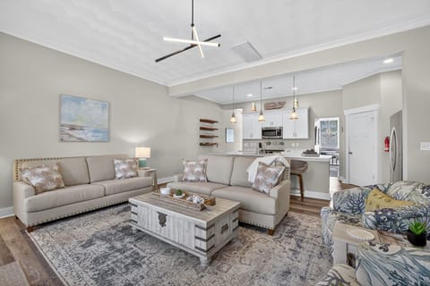 Living area and Open concept, fully stocked kitchen at the back