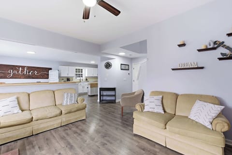 Living Area: Bright and inviting, this living room is for pure relaxation with ample cozy seating, and a calm welcoming vibe.