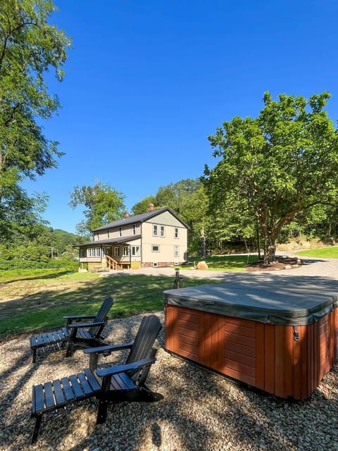 Soak under the stars in your private hot tub, steps from the creek.