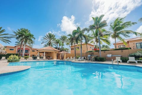 One of three Gold Coast swimming pools, relax in one of the many lounging places, enjoy a shared BBQ grill and find cooling shade in the palapas