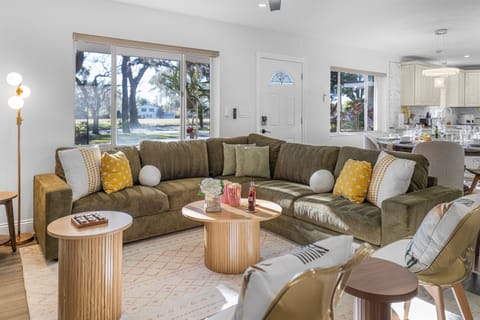 This inviting living space blends modern design with cozy comfort, offering ample seating, warm textures, and a welcoming layout ideal for movie nights or conversation.