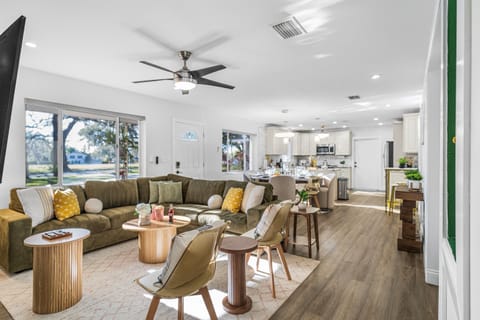 Designed for both style and comfort, this living room offers plenty of seating, tasteful décor, and a bright, airy feel throughout.