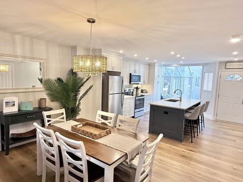Comfortable seating for three is available at the large kitchen island. 