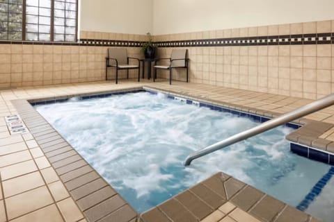 Unwind in bubbling hot tub after a full day out.
