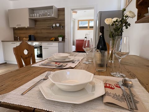 Furniture, Interior Design, Wood, Table, Flooring, Tableware, Kitchen & Dining Room Table, Chair, Dining Room, Room