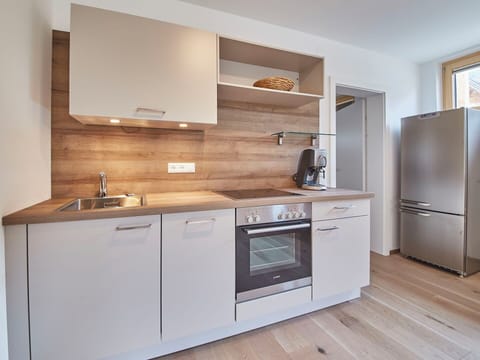 Cabinetry, Countertop, Flooring, Kitchen Appliance, Interior Design, Kitchen, Wood, Major Appliance, Furniture, Floor