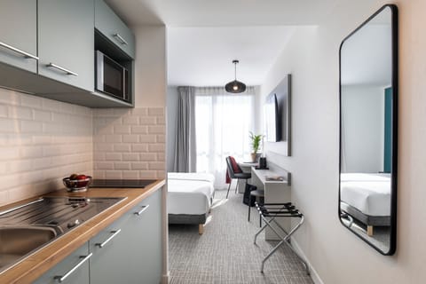 Classic Studio, 2 Twin Beds | Private kitchen | Fridge, microwave, stovetop, dishwasher