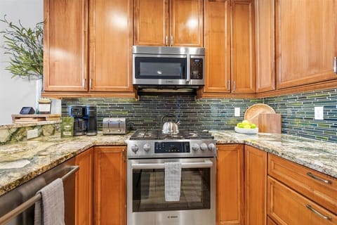 Kitchen: Drip coffee maker, Crockpot, blender, food processor, tableware