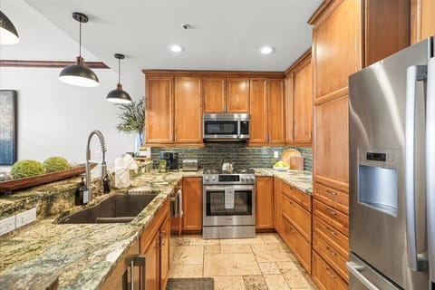 Kitchen: Drip coffee maker, Crockpot, blender, food processor, tableware