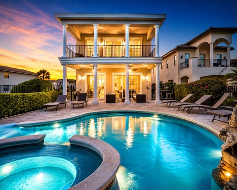 Stunning evening view of the home and pool, creating a true resort experience! 