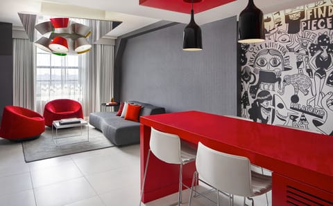 Gather for cocktails in a bold lounge with designer seating.