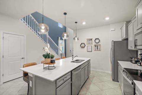 Sleek kitchen with a spacious island, ideal for entertaining and family gatherings.