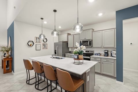 Modern kitchen with sleek design, perfect for culinary adventures. Enjoy stainless steel appliances and stylish decor.