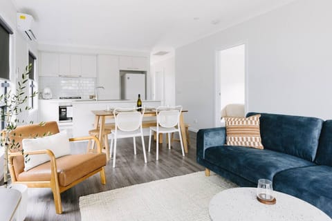 The main living, dining and kitchen area. This are has a smart TV and air conditioning.