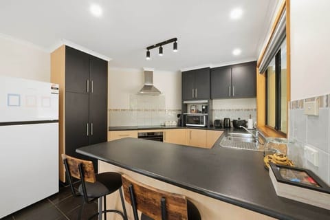 Fully equipped kitchen with modern appliances for home-style cooking.