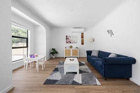 A spacious living area with two comfortable couches and a TV, perfect for relaxing together after a 