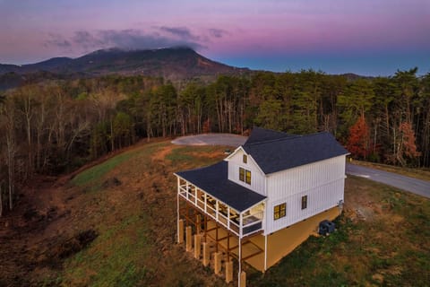 A secluded mountain retreat with sweeping ridge views from the covered deck.