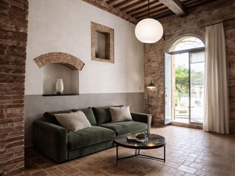 Comfort Quadruple Room, Garden View | Living area