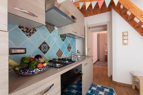 Deluxe Apartment, Patio, Garden View | Private kitchen | Highchair