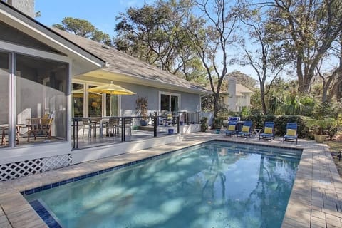 Your private pool oasis awaits with crystal-clear waters, comfortable loungers, and a shaded patio perfect for morning coffee or evening relaxation.
