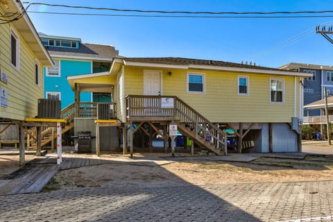 Charming beachside vacation home with easy beach access and parking in a colorful coastal neighborhood.
