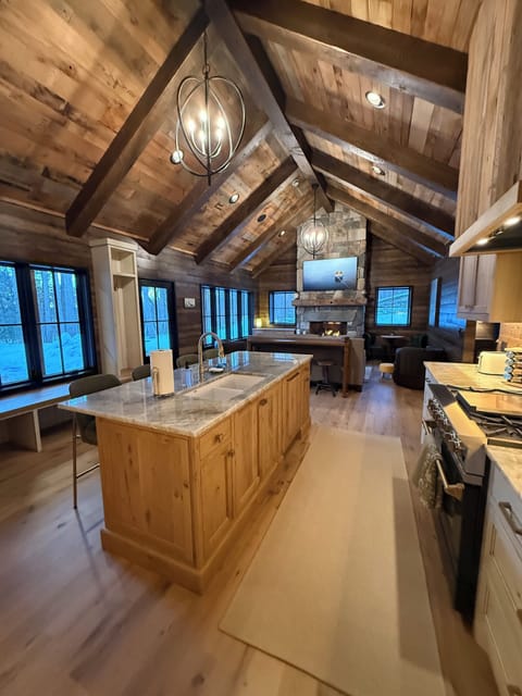 Open kitchen to living room, along with storage lockers.