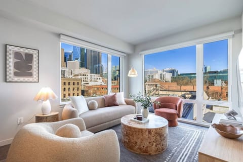 Relax in style with floor-to-ceiling windows and city lights all around.