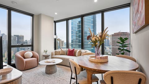 Bright open-plan living and dining with city view