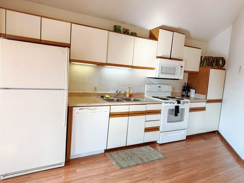 Fully equipped kitchen with modern appliances, ample storage, and everything needed for a comfortable stay.