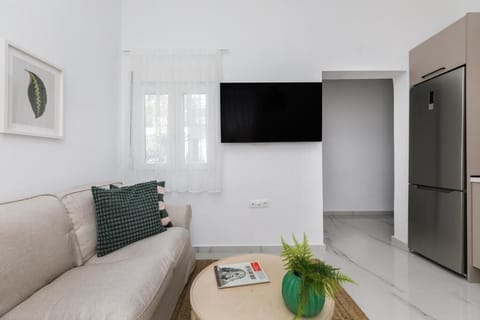 Apartment, 2 Double Beds, City View | Living area | 40-inch Smart TV with digital channels