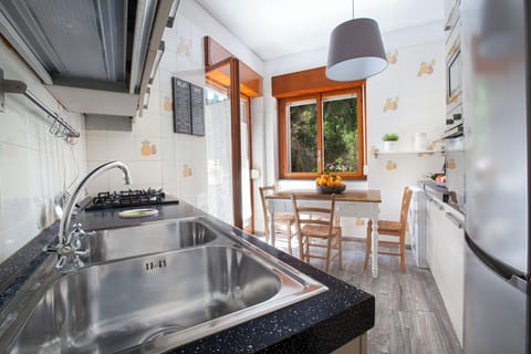 Apartment, Balcony, Partial Sea View | Private kitchen | Full-size fridge, microwave, oven, stovetop