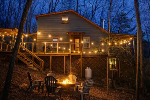Gather around the firepit under warm string lights and enjoy peaceful mountain evenings surrounded by trees. A cozy outdoor space to relax and take in the North Georgia mountain air.