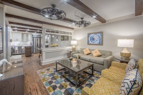 Bright living area with comfortable seating and a relaxed layout, ideal for unwinding after a beach-filled day.
