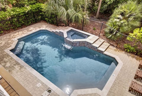 Dive into your private pool and unwind in the adjacent spa, surrounded by lush tropical landscaping for ultimate relaxation.