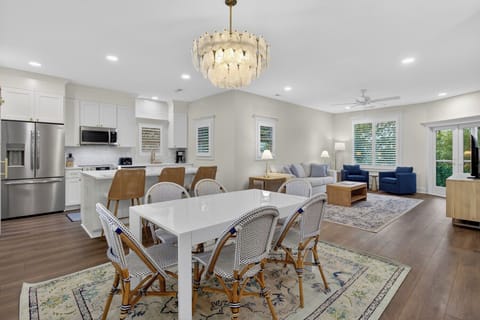 Your elegant open-concept living space features a gourmet kitchen, stylish dining area, and cozy lounge—perfect for gathering.