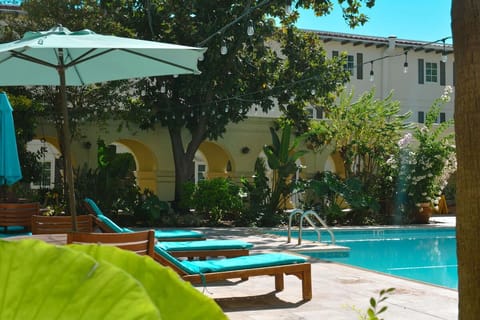 Lounge on cushioned sunbeds and savor breezy afternoon calm.