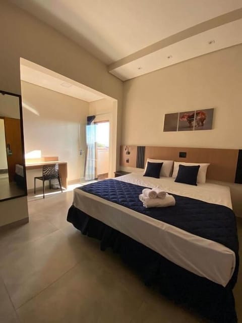 Deluxe Suite, Balcony, City View | Desk, laptop workspace, free WiFi