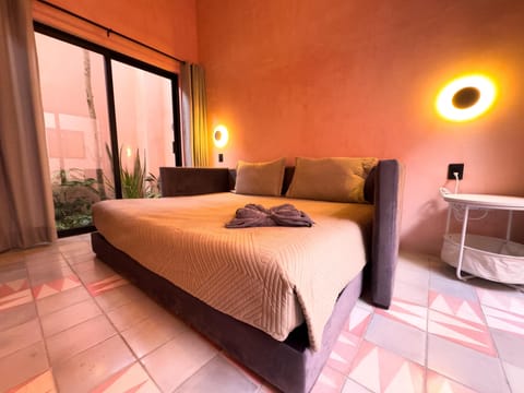Cozy bedroom with warm lighting and balcony views