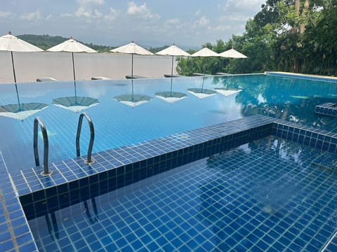 Outdoor pool, open 8:00 AM to 7:00 PM, sun loungers