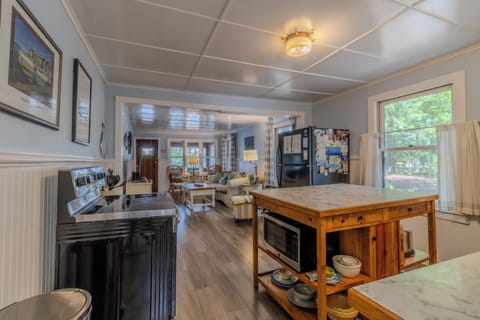 Kitchen and living room - The home enters into the laundry room, and then moves into the kitchen and living area.