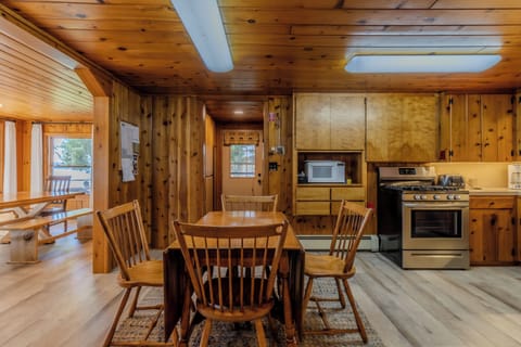 Additional Dining - An additional dining table in the kitchen area. The door to the side yard is visible.