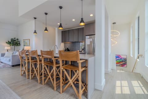 Upper Level - Entry - Immediately at the top of the stairs is the kitchen and dining room area with windows overlooking downtown Traverse City.