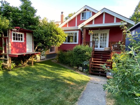 Gorgeous home, character meets modern. Front yard with treehouse.