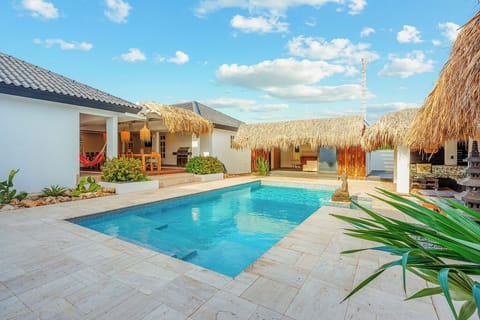 Indulge in the luxury of a private swimming pool, thoughtfully designed with ample space for relaxation, rejuvenation, and savoring every moment under Aruba’s golden rays
