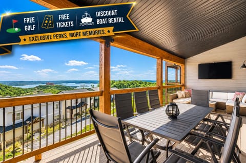 Deck with outdoor seating, streaming TV, and a lake view!