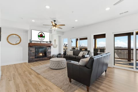 Living area with seasonal fireplace, streaming TV, comfortable seating, and a great lake view!