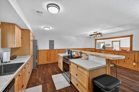 The kitchen is fully stocked with cookware, dishes, utensils and new stainless steel appliances. 