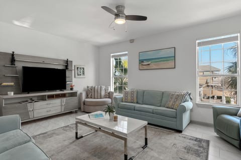 Bright, coastal-inspired living room with comfortable seating and natural light.
